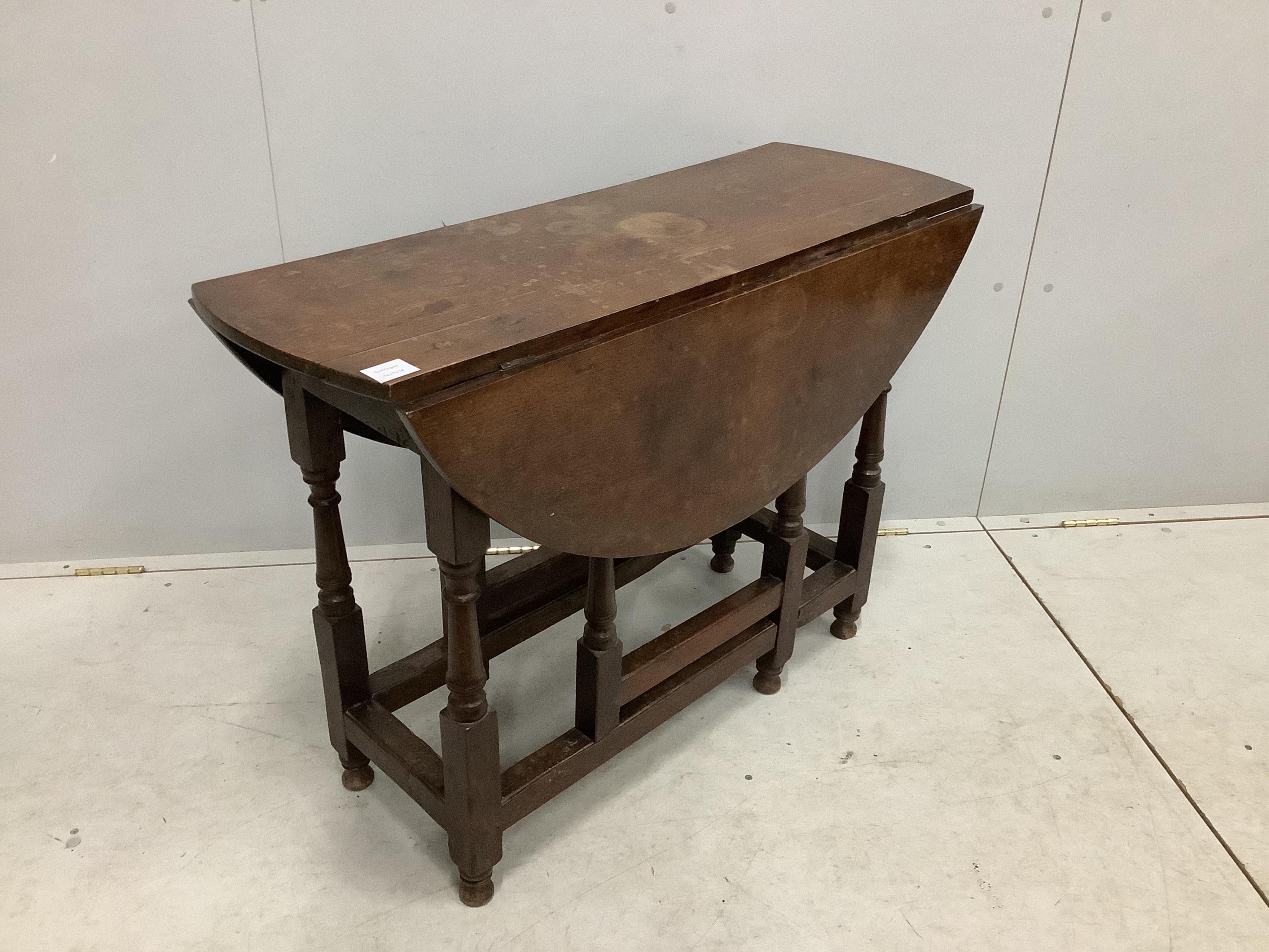 A small 18th century oak gate leg table, width 99cm, depth 38cm, height 72cm. Condition - fair